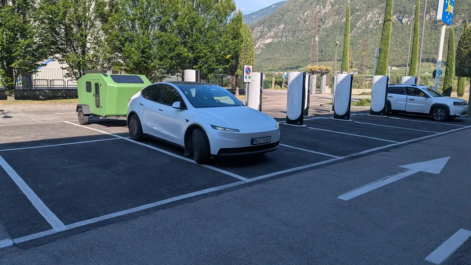 Tesla Model Y with the Glide at a Supercharger in the Adige valley