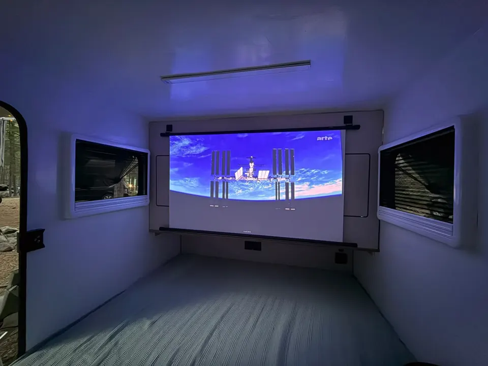 Projection screen in the darkened bedroom